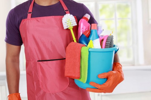 Staff member discussing a cleaning complaint procedure with a client